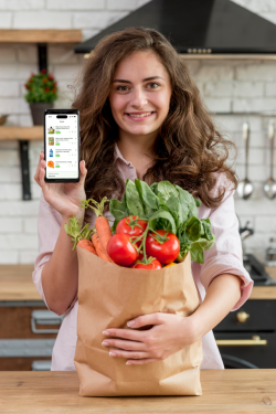 brunette-woman-with-paper-bag-full-healthy-food